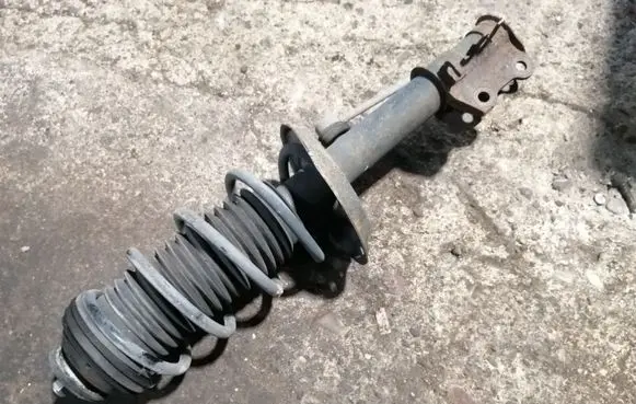 Opel Corsa D Front shock absorber with coil spring 13214354