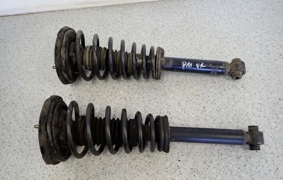 Nissan Primera Front shock absorber with coil spring