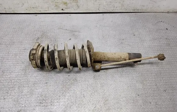 Volkswagen Caddy Front shock absorber with coil spring