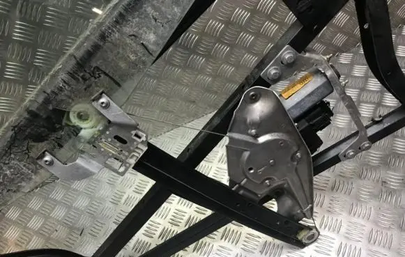 Sliding door window regulator with motor
