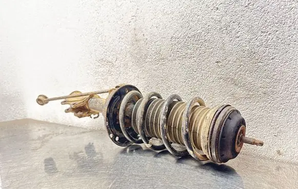 Opel Corsa D Front shock absorber with coil spring 13399044