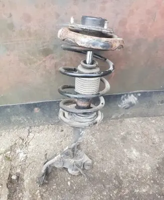 Nissan Primera Front shock absorber with coil spring