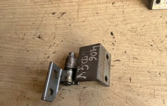 Rear door upper hinge
