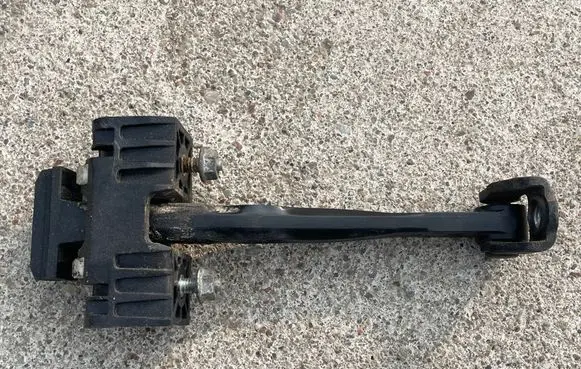 Opel Zafira B Front door check strap stopper 13227947