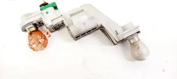 Tail light bulb cover holder