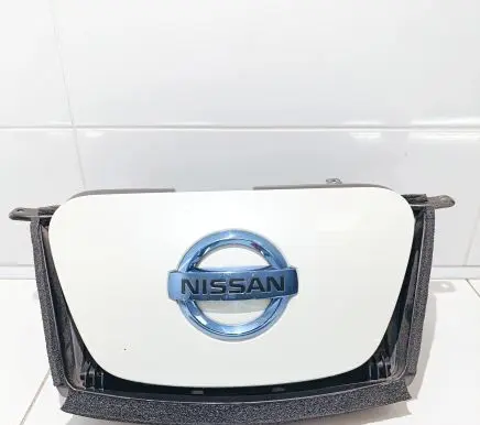 Nissan Leaf I (ZE0) Electric car charge socket cover 657303NA1A
