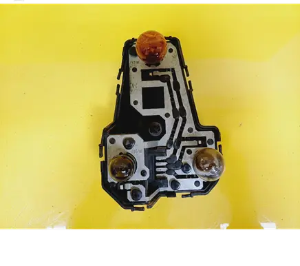 Tail light bulb cover holder