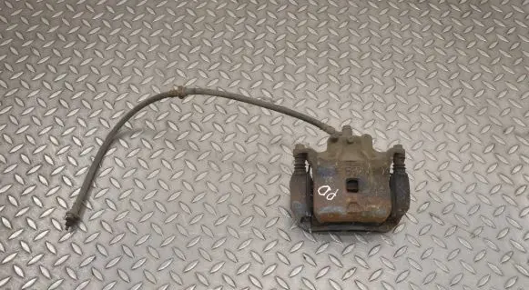 Nissan Juke I F15 Front brake caliper