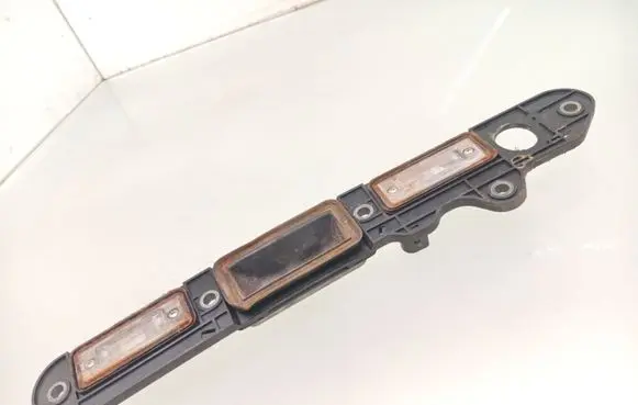 Volkswagen Touran I Trunk door license plate light bar 1T0827574C