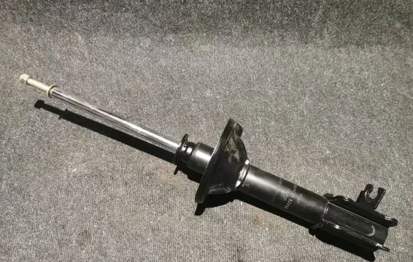 Mazda 323 Front shock absorber/damper B44528700