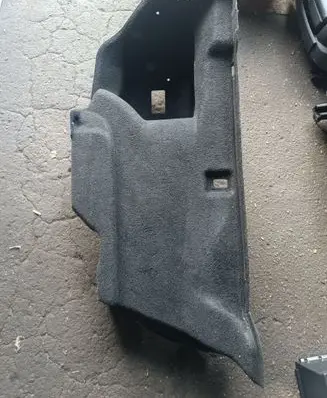 Trunk/boot lower side trim panel