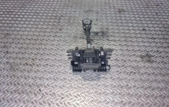 Front door check strap stopper