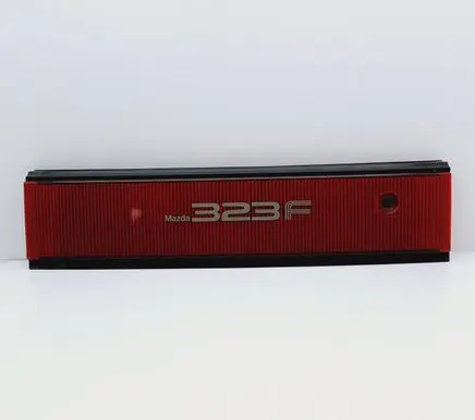 Mazda 323 F Trunk door license plate light bar 067-4434
