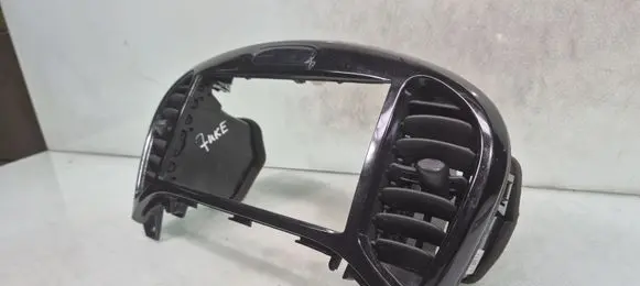 Nissan Juke I F15 Dash center air vent grill 687501KE0A