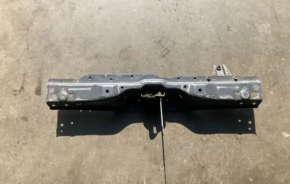 Top upper radiator support slam panel