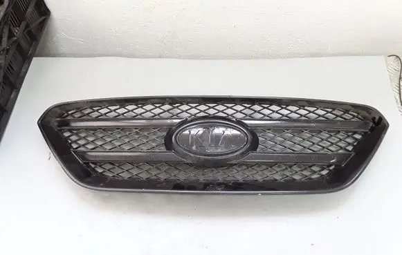 KIA Carens II Front bumper upper radiator grill 8638010000