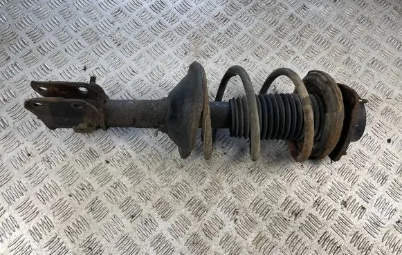 Subaru Impreza I Front shock absorber with coil spring
