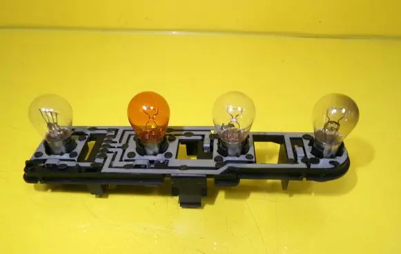 Tail light bulb cover holder