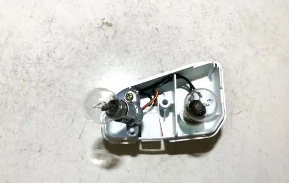 Tail light bulb cover holder