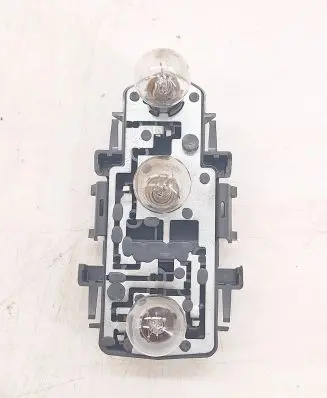 Tail light bulb cover holder