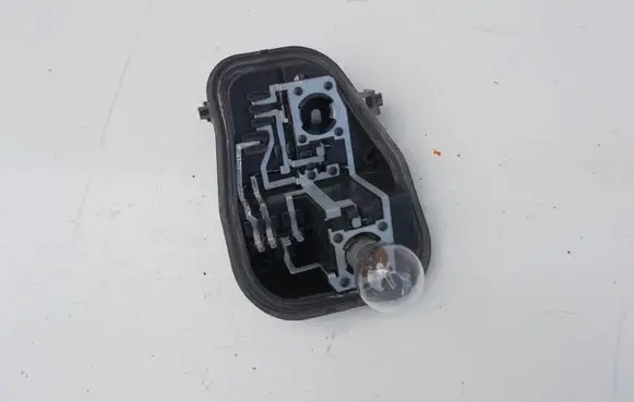 Tail light bulb cover holder