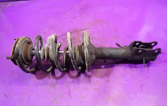 Nissan Almera Tino Front shock absorber with coil spring 