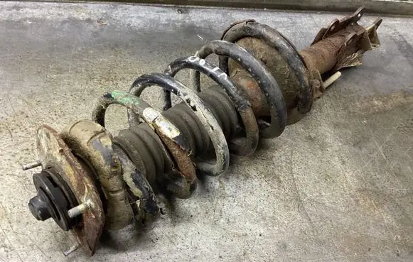 Front shock absorber with coil spring