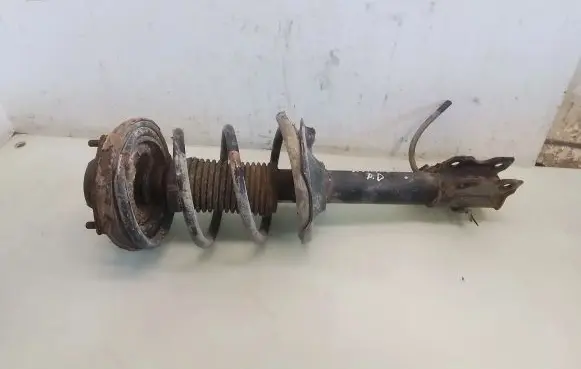 Nissan X-Trail T30 Front shock absorber with coil spring