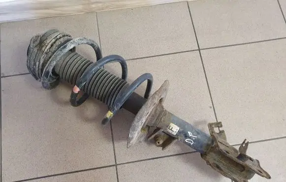 Nissan X-Trail T31 Front shock absorber with coil spring