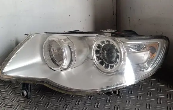 Volkswagen Touareg I Headlight/headlamp 7L6941031A 24703203000
