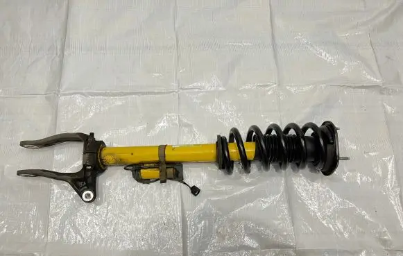 Jeep Grand Cherokee Front shock absorber with coil spring 68256885AB
