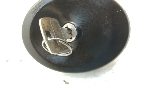 Fuel tank cap lock