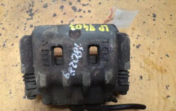 Subaru Forester SF Front brake caliper