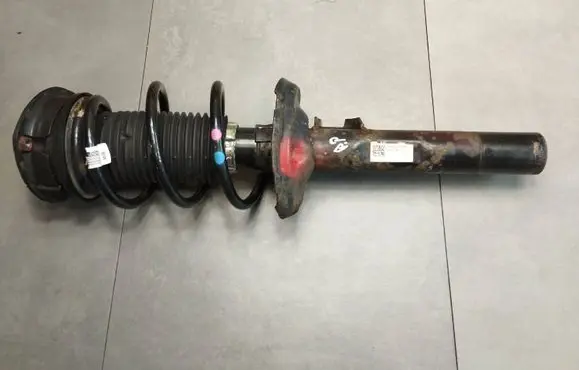 Volkswagen Golf VII Front shock absorber with coil spring 5Q0413023FH