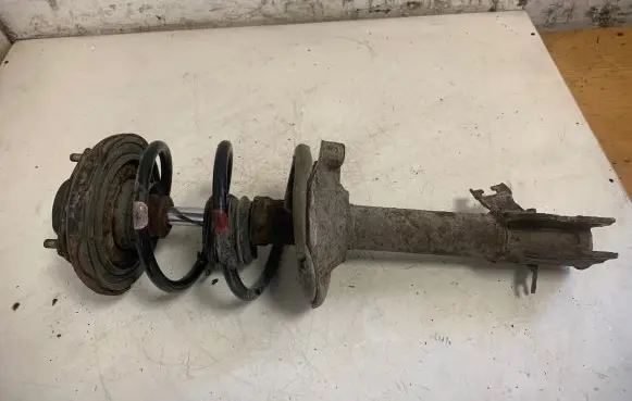 Nissan X-Trail T30 Front shock absorber with coil spring