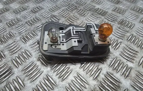 Volkswagen Touareg I Tail light bulb cover holder 7L6945257