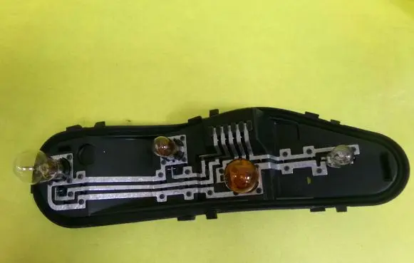 Mitsubishi Colt Tail light bulb cover holder