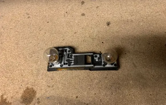 Nissan Primera Tail light bulb cover holder 2331