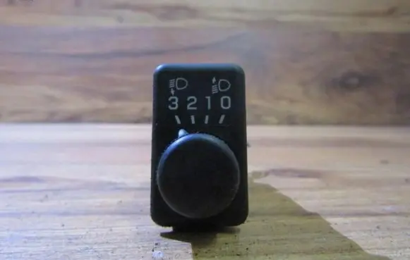 Headlight level height control switch