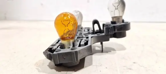 Tail light bulb cover holder