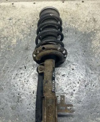 Opel Zafira B Front shock absorber with coil spring