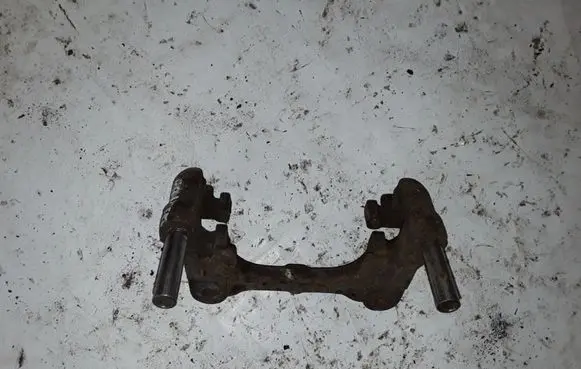 Nissan Primera Brake caliper pad carrier rear NOCODE