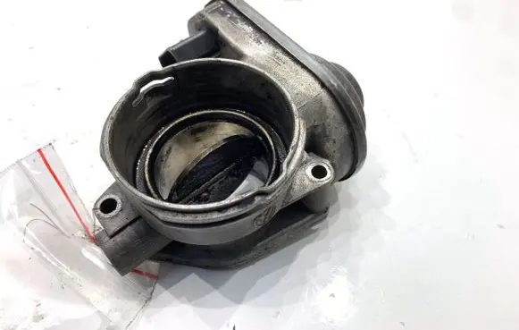 Volkswagen Touran I Engine shut-off valve 038128063G
