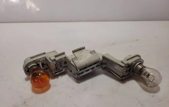 Volvo V50 Tail light bulb cover holder