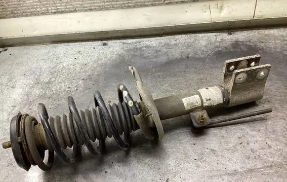Front shock absorber with coil spring