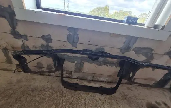 Radiator support slam panel