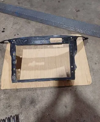 Radiator support slam panel