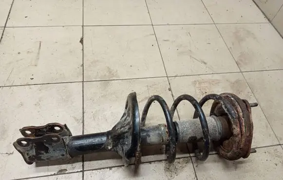 Mitsubishi Lancer Front shock absorber with coil spring