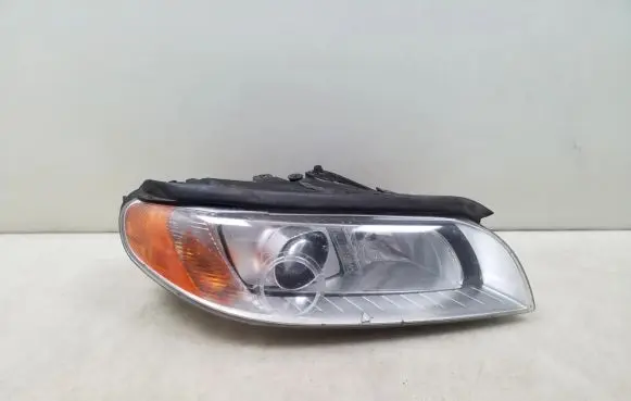 Mitsubishi Pajero Sport I Headlight/headlamp 31214348