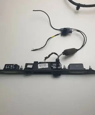 Trunk door license plate light bar
